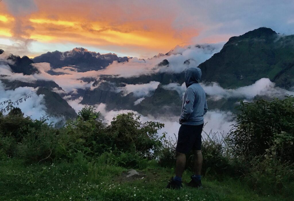 Watching sunset in Auli on a monsoon trek in India