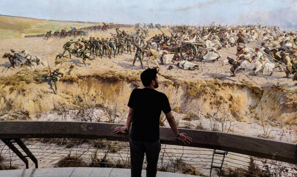 Standing at the viewing platform looking at the panorama painting of the battle of Raclawice in Wroclaw