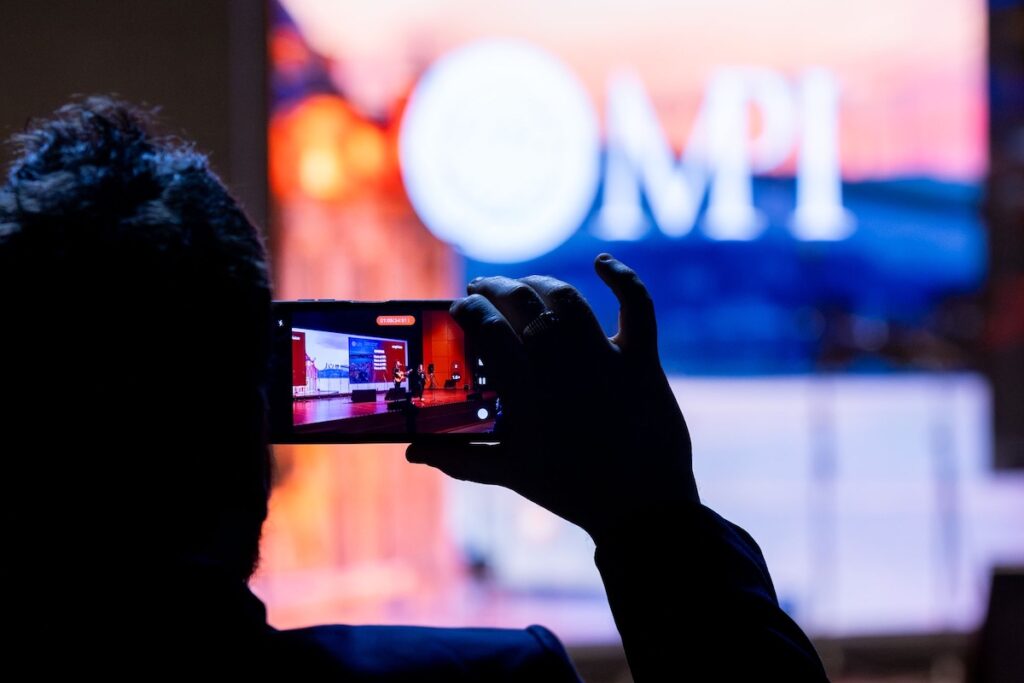 A person capturing photo during the event of MPI Poland Chapter