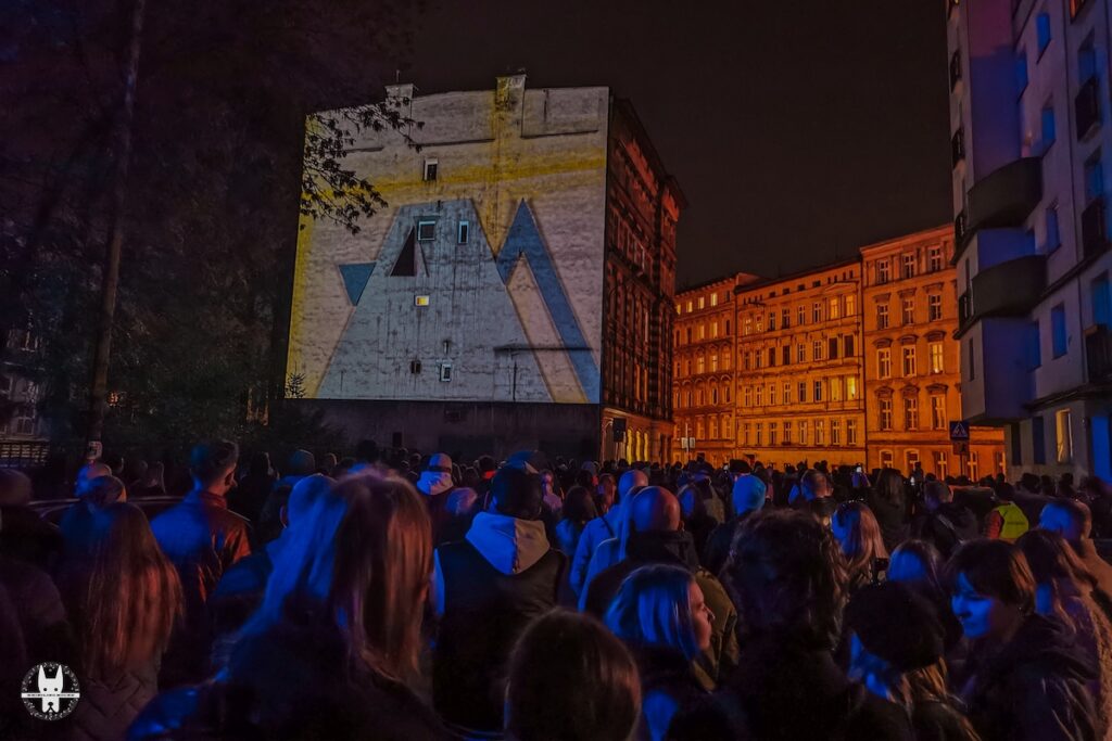 Locals watching Kino Mural in Nadodrze Wrocław