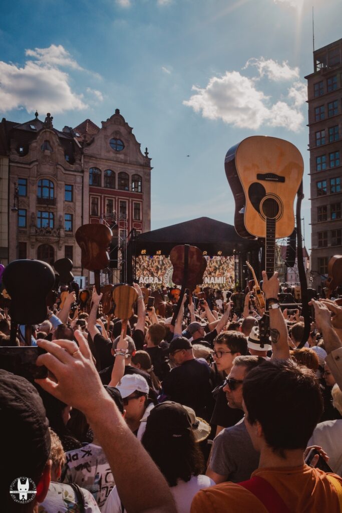 People raising guitar at the Guitar World Record 2025 Wrocław