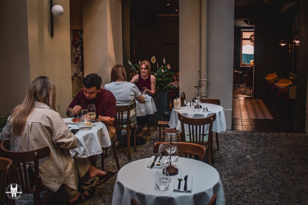 Locals eating at Le Gosse restaurant in Wrocław