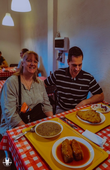 Tourist on Wrocław walking tour with food tasting