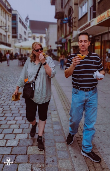 Tourist on Wrocław walking tour tasting paczki