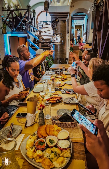 An American tourist group on Wrocław walking tour with food tasting