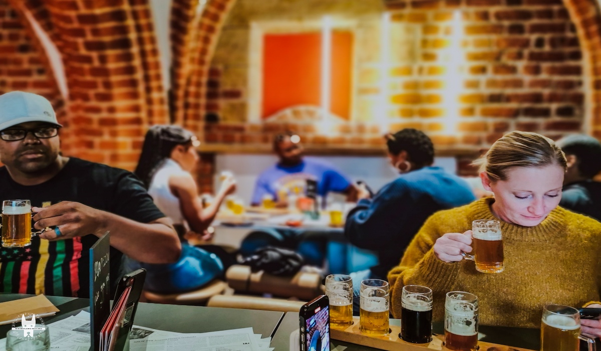 Tourists tasting craft beer during Wrocław food tasting tour