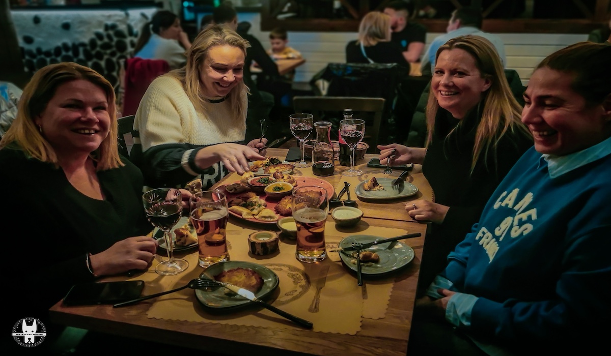 British tourists in Wrocław tasting pierogis during Wrocław food tasting tour