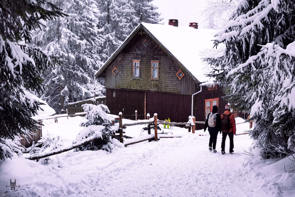 Hikers passing by a mountain shelter in Lower Silesia Poland